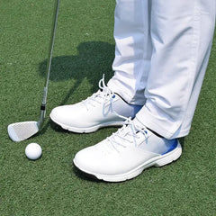 Golfer wearing Sampson Men's Golf Shoes on the green with a golf club and ball nearby.