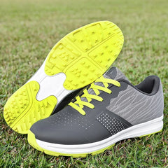 Waterproof men's golf shoes with neon yellow soles and laces on grass field.