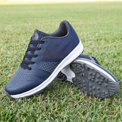 Men's waterproof golf shoes, blue training sneakers on grass, showcasing grip sole and stylish design for superior comfort and performance.