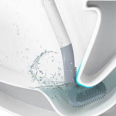 Golf silicone toilet brush with holder cleaning a white toilet, featuring water splash and soft bristles for effective hygiene.