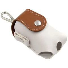 Mini leather golf ball pouch with snap closure and clip, designed for convenient access and secure storage on the golf course.