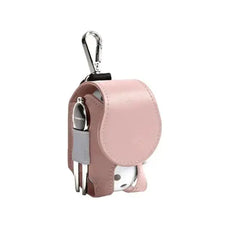 Mini leather golf ball pouch with snap closure and clip for easy attachment, holding golf balls and tees stylishly and conveniently.