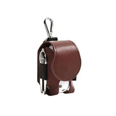 Mini leather golf ball pouch with snap closure, holding a white golf ball and tees, featuring a clip for easy attachment.