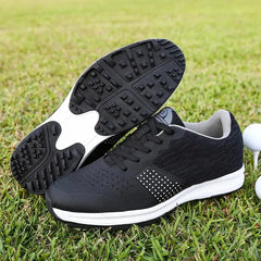 Black waterproof men's golf shoes on grass, featuring durable soles for optimal traction and comfort during training.