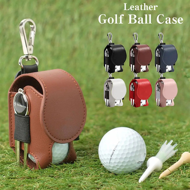 Mini leather golf ball pouch with snap closure and keychain, shown in various colors, holding golf balls and tees on grass.