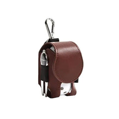 Mini leather golf ball pouch with snap closure, holding a white golf ball and tees, featuring a clip for easy attachment.